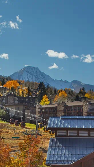 Aspen Mountain in the fall, gondola running past beautiful hotels