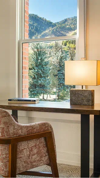 nice chair at desk overlooking mountain scene at limelight aspen