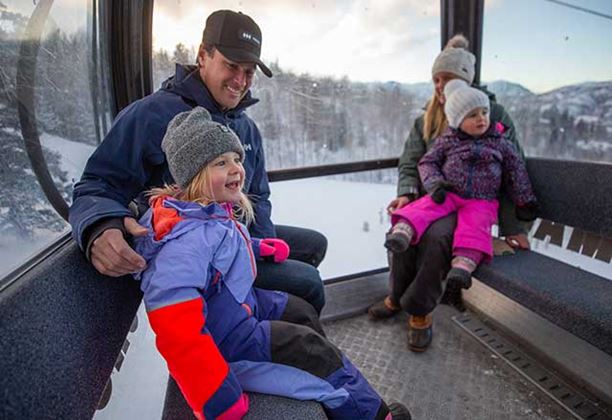 A family sightseeing from one of Aspen Snowmass' gondolas